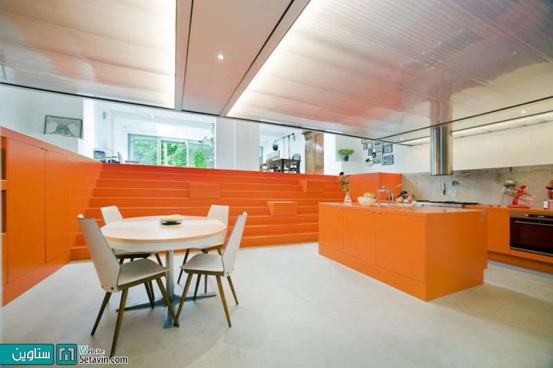 تبدیل مکانیکی سابق  به آشپزخانه ای پوشیده شده از رنگ نارنجی